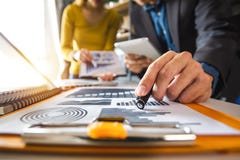 Business documents on office table with smart phone and digital tablet and graph stock photo Business documents on office table with smart phone and digital tablet and graph stock photo