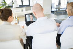 Business team having video conference at office royalty free stock photo Business team having video conference at office royalty free stock photo