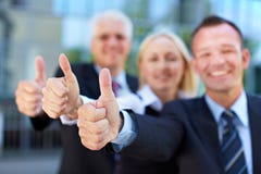 Business group holding thumbs up stock images Business group holding thumbs up stock images