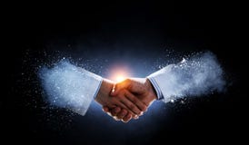 Business Handshake By A Man And A Woman. Royalty Free Stock Photography Business Handshake By A Man And A Woman. Royalty Free Stock Photography