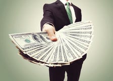 Business Man Displaying a Spread of Cash stock photography Business Man Displaying a Spread of Cash stock photography