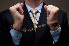 Business man in handcuffs