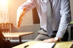 A business man with an open hand extended to handshake Royalty Free Stock Image A business man with an open hand extended to handshake Royalty Free Stock Image