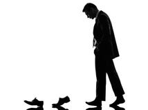 Business man walking behind his shoes clothes silhouette royalty free stock image Business man walking behind his shoes clothes silhouette royalty free stock image