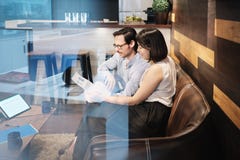 Business Man And Woman Meeting At Work In Office Cafeteria stock photo Business Man And Woman Meeting At Work In Office Cafeteria stock photo