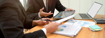 Business Partner Consulting On Their Collaboration With Digital Device And Document File In Meeting Room Stock Photography Business Partner Consulting On Their Collaboration With Digital Device And Document File In Meeting Room Stock Photography