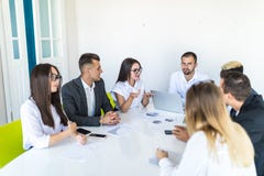 Business people discussing the charts and graphs showing the results of their successful teamwork, multi ethnic business. Business stock image Business people discussing the charts and graphs showing the results of their successful teamwork, multi ethnic business. Business stock image