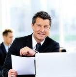 Business people having meeting around table Stock Photo Business people having meeting around table Stock Photo