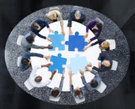 Business People with Puzzle Pieces and Teamwork Concept Royalty Free Stock Photos Business People with Puzzle Pieces and Teamwork Concept Royalty Free Stock Photos