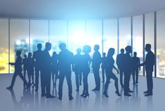 Business people silhouettes in night office Stock Photography Business people silhouettes in night office Stock Photography