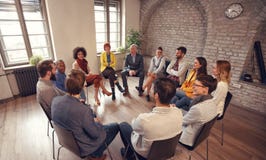 Business people talking at group meeting