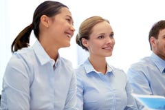 Group of smiling businesspeople meeting in office Royalty Free Stock Photo Group of smiling businesspeople meeting in office Royalty Free Stock Photo