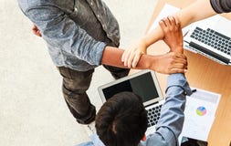 Business People Teamwork Meeting joining hands in triangle in the office concept, Using Ideas, Charts, Computers, Tablet, Smart stock images Business People Teamwork Meeting joining hands in triangle in the office concept, Using Ideas, Charts, Computers, Tablet, Smart stock images