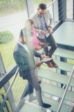 Business people using digital tablet in building office. Business people reading document. royalty free stock photography Business people using digital tablet in building office. Business people reading document. royalty free stock photography