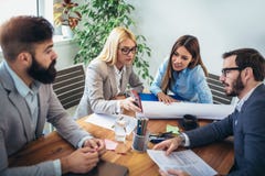 Business people working together on project in office Stock Image Business people working together on project in office Stock Image