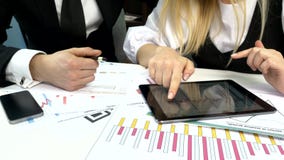 Business peoples developing a business project and stock video Business peoples developing a business project and stock video