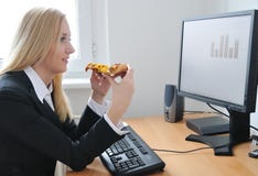 Business person eating pizza at work royalty free stock image Business person eating pizza at work royalty free stock image