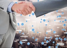 Business professionals shaking hands against networking icons in background Royalty Free Stock Photos Business professionals shaking hands against networking icons in background Royalty Free Stock Photos