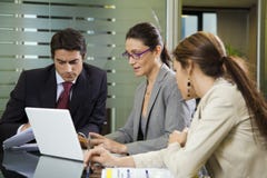 Business team. People at work: business team having a meeting Business team. People at work: business team having a meeting
