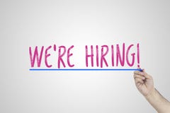Business Team Concept Hand writing we`re hiring. royalty free stock images Business Team Concept Hand writing we`re hiring. royalty free stock images
