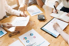 Business team meeting discussing working analysis with financial stock photo Business team meeting discussing working analysis with financial stock photo
