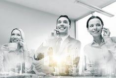Business team with smartphones working at office stock images Business team with smartphones working at office stock images