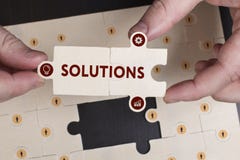 Business, Technology, Internet and network concept. Young businessman shows the word: Solutions royalty free stock photography Business, Technology, Internet and network concept. Young businessman shows the word: Solutions royalty free stock photography
