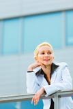 Business woman leaning on railing at office Royalty Free Stock Photography Business woman leaning on railing at office Royalty Free Stock Photography