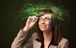 Business woman looking at high tech number calculations stock photo Business woman looking at high tech number calculations stock photo