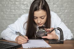 Business woman is reading the contract very carefully Stock Image Business woman is reading the contract very carefully Stock Image