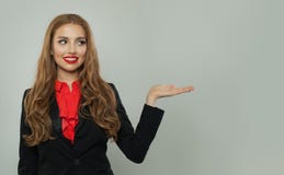 Business woman showing empty open hand on white background. Woman smiling, business and education concept stock images Business woman showing empty open hand on white background. Woman smiling, business and education concept stock images