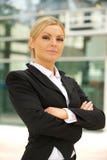 Business woman standing outdoors with arms crossed stock photography Business woman standing outdoors with arms crossed stock photography