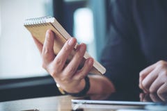 A business woman working , holding notebook and using tablet pc Stock Photography A business woman working , holding notebook and using tablet pc Stock Photography