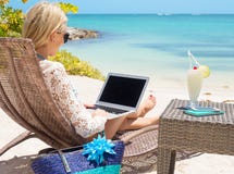 Business Woman Working With Computer On The Beach Stock Images