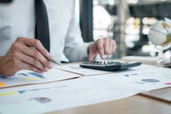 Businessman accountant working analyzing and calculating expense financial annual financial report balance sheet statement, doing stock photography Businessman accountant working analyzing and calculating expense financial annual financial report balance sheet statement, doing stock photography