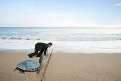 Businessman And Turtle Are Ready To Race On Sand Beach Royalty Free Stock Image Businessman And Turtle Are Ready To Race On Sand Beach Royalty Free Stock Image