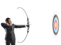 Businessman with bow and arrow stock photos Businessman with bow and arrow stock photos
