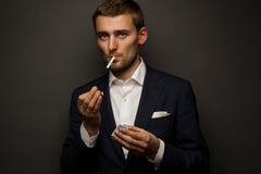 Businessman with cigarette stock photography Businessman with cigarette stock photography