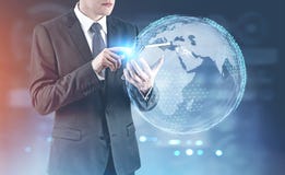 Businessman with a digital tablet, Earth stock images Businessman with a digital tablet, Earth stock images