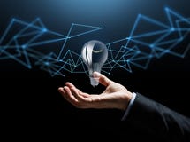 Businessman hand with bulb over dark background royalty free stock photo Businessman hand with bulb over dark background royalty free stock photo