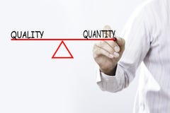 Businessman hand drawing Quality and Quantity balance - Business royalty free stock photo Businessman hand drawing Quality and Quantity balance - Business royalty free stock photo