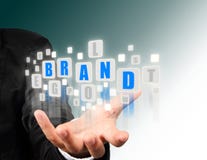 Businessman hand holding with blue brand alphabet royalty free stock photo Businessman hand holding with blue brand alphabet royalty free stock photo