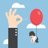 Businessman hand pushing needle to pop the balloon of his rival Stock Photos Businessman hand pushing needle to pop the balloon of his rival Stock Photos