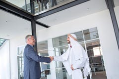 Businessman handshake with Arabian partner royalty free stock photo Businessman handshake with Arabian partner royalty free stock photo