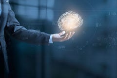 Businessman holding digital human brain and icon graphic royalty free stock images Businessman holding digital human brain and icon graphic royalty free stock images