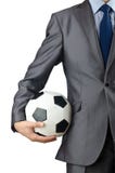 Businessman holding football