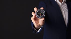 Businessman holds compass in his hand stock photography Businessman holds compass in his hand stock photography