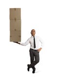 Businessman holds a pile of packages in a hand. concept of fast delivery royalty free stock images Businessman holds a pile of packages in a hand. concept of fast delivery royalty free stock images