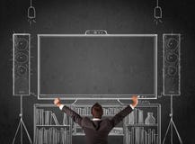 Businessman In Front Of A Home Cinema System Royalty Free Stock Photo
