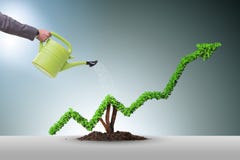 The businessman in investment concept watering financial line chart Stock Photos The businessman in investment concept watering financial line chart Stock Photos